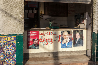 A Cuban ration store today with photos of Fidel and Raul Castro and Hugo Chavez.